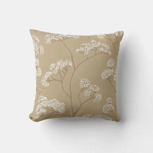 Bushes of small white flowers in beige colour pale cushion