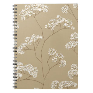 Bushes of small white flowers in beige colour pale notebook