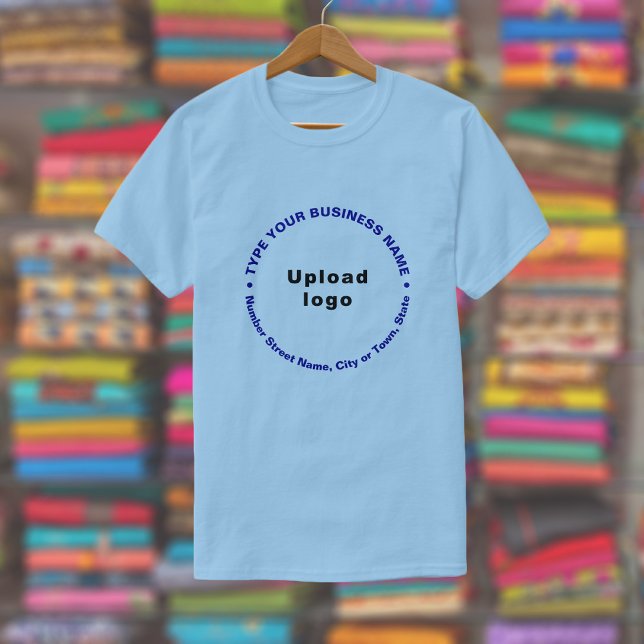 Business Brand in Round Pattern Text on Light Blue T-Shirt (Light blue t-shirt with round pattern text business branding displayed in a store)
