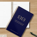 Business Logo Navy Blue and Gold Planner<br><div class="desc">Stay organised and professional with this sleek navy blue and gold business planner, fully customisable with your company logo, name, and year. Perfect for corporate branding, this spiral-bound planner is designed to keep your team meetings, client appointments, and daily tasks in check. Ideal for promotional giveaways, employee branding, and client...</div>