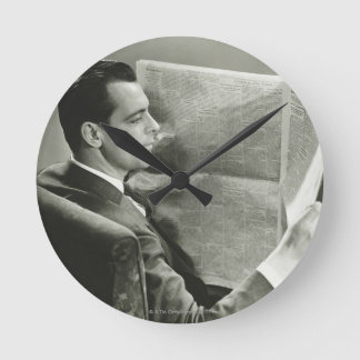Businessman Reading the Newspaper Round Clock