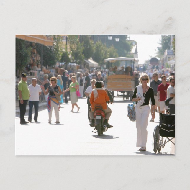 Busy street in Katakolon Greece Postcard (Front)