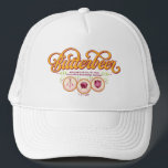 BUTTERBEER™ Available At Wizarding Taverns Trucker Hat<br><div class="desc">Raise a glass to the wizarding world with this charming Butterbeer™ design! Featuring elegant, swirling typography and a warm, vintage-inspired color palette, this artwork celebrates the most beloved drink in magical history. Accented with playful details and references to iconic wizarding taverns like the Three Broomsticks™, the Leaky Cauldron™, and the...</div>