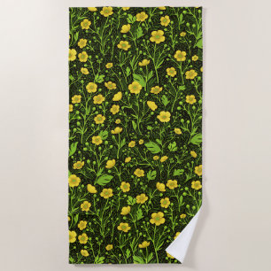 Buttercups on black beach towel