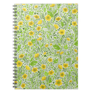 Buttercups on white notebook