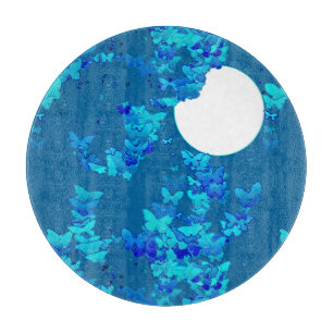 Butterflies against blue night sky, moonscape cutting board