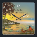 Butterflies Love Sunset Lake Wall Clock<br><div class="desc">A romantic clock featuring a painting of a sunset at a waterfront with butterflies and a blossoming tree. A great wedding gift,  Valentine's Day present or a gift for any romantic occasion!</div>