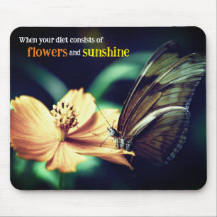 Butterfly feeding on flower mouse mat