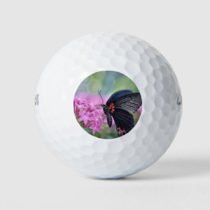 Butterfly on flower golf balls