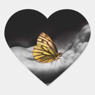 Butterfly on hand heart sticker