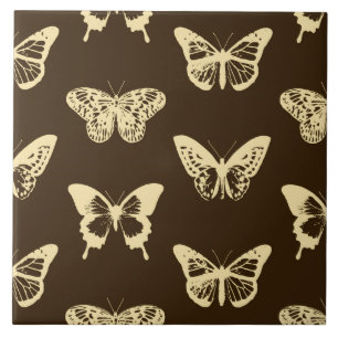 Butterfly sketch, beige on chocolate brown tile