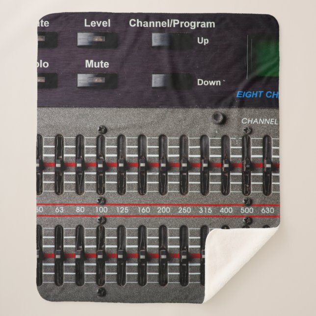 Buttons on a sound mixer in a recording studio. sherpa blanket (Front)