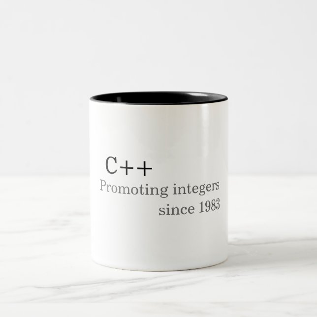 C++: Promoting integers since 1983 (mug) Two-Tone Coffee Mug (Center)