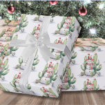 Cactus Snowman Christmas Wrapping Paper<br><div class="desc">Watercolor Cactus Snowman Christmas Wrapping Paper. This playful wrapping paper features a whimsical watercolor snowman surrounded by green cacti and succulents, all adorned with colourful holiday lights. It combines the charm of winter with the warmth of desert vibes, making it a fun and festive choice for your holiday gift wrapping....</div>