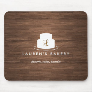 Cake Monogram Logo in White on Brown Woodgrain Mouse Mat