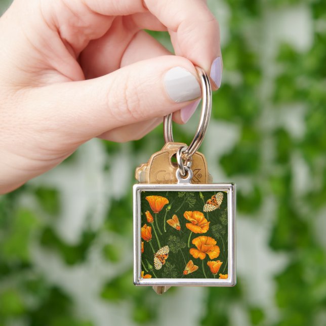 California poppies and moths on dark green key ring (Hand)