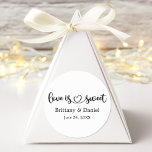 Calligraphy Heart Love Is Sweet Wedding Favour Classic Round Sticker<br><div class="desc">Modern Calligraphy Script Heart Minimalist Simple Love Is Sweet Wedding Favour Sticker - Couple Names & Date - Black & White</div>