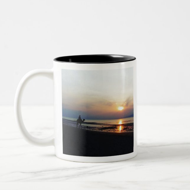 Camel on the beach at Sunset Two-Tone Coffee Mug (Left)