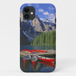 Canada, Alberta, Moraine Lake. Red canoes await iPhone 11 Case