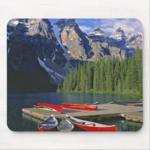 Canada, Alberta, Moraine Lake. Red canoes await Mouse Mat