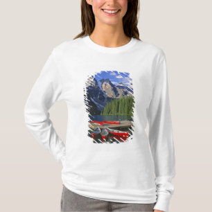 Canada, Alberta, Moraine Lake. Red canoes await T-Shirt