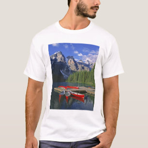Canada, Alberta, Moraine Lake. Red canoes await T-Shirt