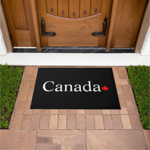 Canada typography with red maple leaf Black Doormat