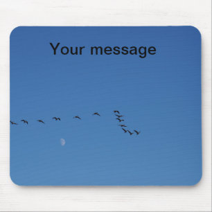 Canadian geese in flight mouse mat