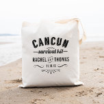 Cancun Survival Kit | Wedding Welcome Tote Bag<br><div class="desc">Greet your guests with some key wedding survival essentials (water, snacks, pain reliever, bandages, sewing kit, etc) in these cute Cancun wedding welcome bags! Design features "Cancun Survival Kit" in black vintage apothecary-style text. Personalise with your names and wedding date; use the "Customise It" button to adjust font size based...</div>