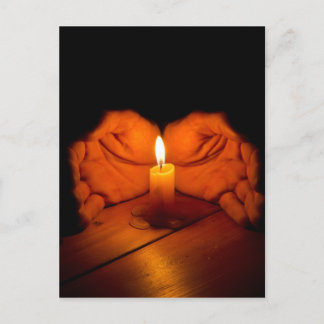 Candle, hands, flame, wood. postcard