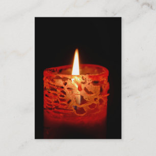 Candle on a black background business card