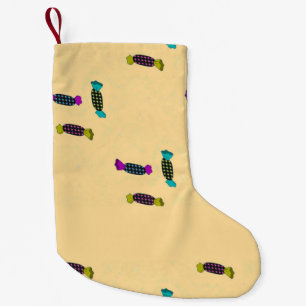 Candy with wraps on cream small christmas stocking
