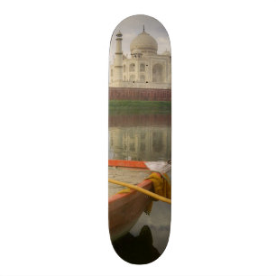 Canoe in water with Taj Mahal, Agra, India Skateboard