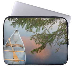 Canoe on lake at sunset, Canada Laptop Sleeve