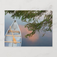 Canoe on lake at sunset, Canada