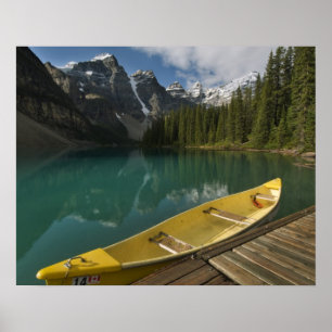 Canoe parked at a dock along Moraine Lake, Banff Poster