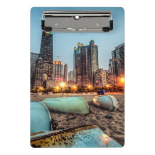 Canoes on Oak Street Beach a little after sunset Mini Clipboard