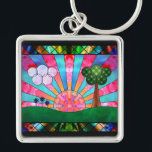 Canticle of the Sun Keychain<br><div class="desc">A digital stained-glass design in the Art Deco style popular in the 20th century. The widely-used sunburst motif is central, rising behind a green landscape balanced by a tree on one side and clouds and flowers on the other. Geometric shapes are used to emphasise the symmetry of the scene, with...</div>