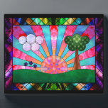 Canticle of the Sun Photo Plaque<br><div class="desc">A digital stained-glass design in the Art Deco style popular in the 20th century. The widely-used sunburst motif is central, rising behind a green landscape balanced by a tree on one side and clouds and flowers on the other. Geometric shapes are used to emphasise the symmetry of the scene, with...</div>