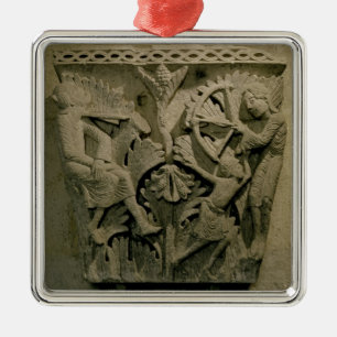 Capital depicting a man shooting an arrow into the metal tree decoration