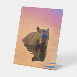 Capybara Emerging From a Tranquil Body of Water Pedestal Sign