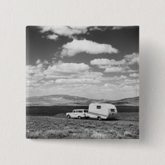 Car pulling trailer on road 15 cm square badge