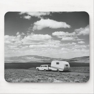 Car pulling trailer on road mouse mat