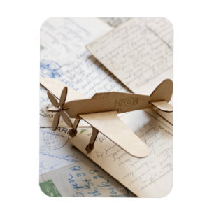 Carboard aeroplane on postcards magnet