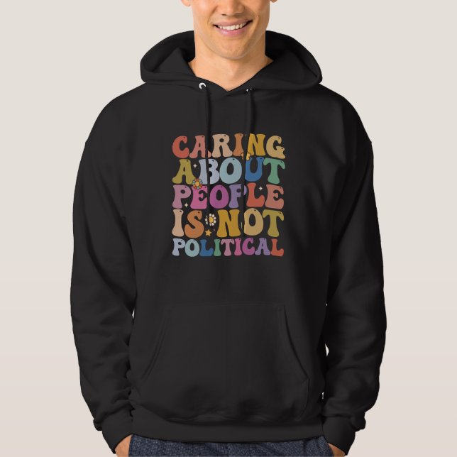 Caring About People Is Not Political Groovy Retro Hoodie (Front)