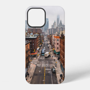 CARS ON ROAD BETWEEN HIGH RISE BUILDINGS DURING DA iPhone 12 CASE
