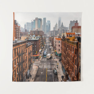 CARS ON ROAD BETWEEN HIGH RISE BUILDINGS DURING DA TAPESTRY