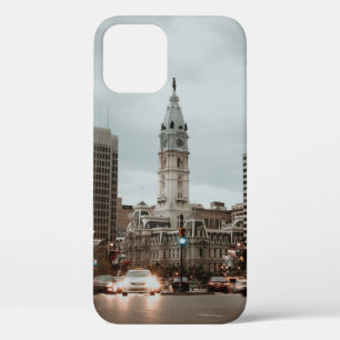CARS ON ROAD NEAR HIGH RISE BUILDINGS DURING DAYTI iPhone 12 CASE
