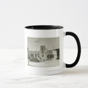 Cars parked at gas station mug