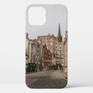 CARS PARKED BESIDE BROWN CONCRETE BUILDING DURING iPhone 12 CASE